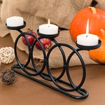 металлический подсвечник на три свечи